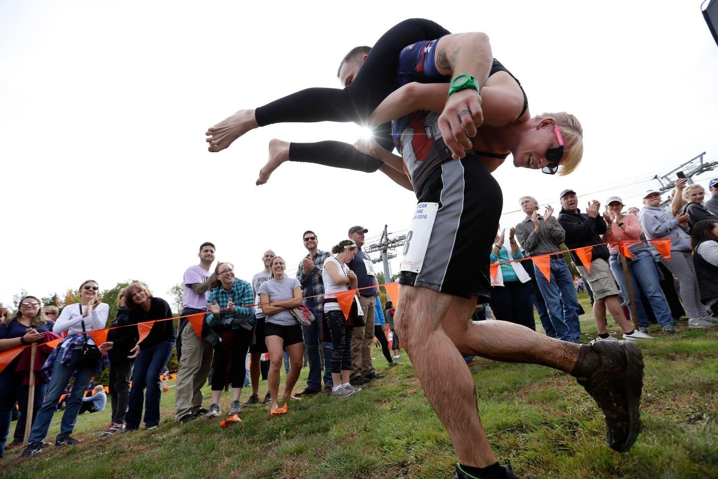 Man carrying wife in competition